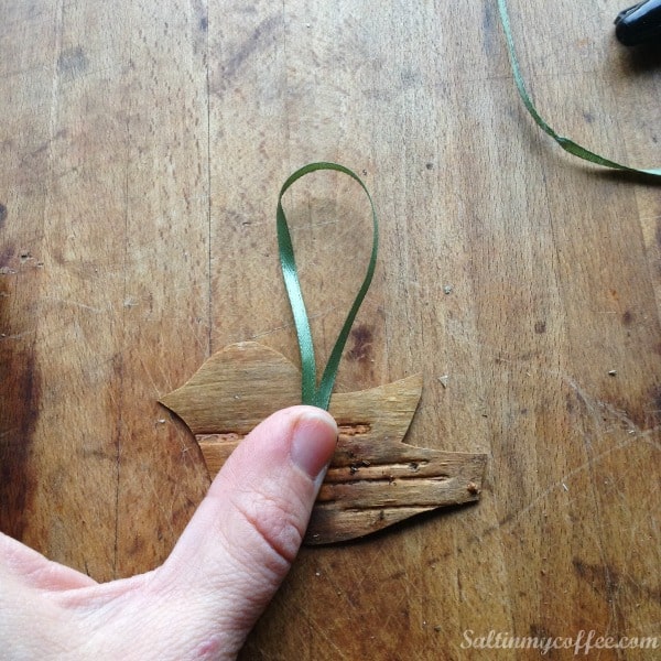 glueing birch bird ornaments for the Christmas tree