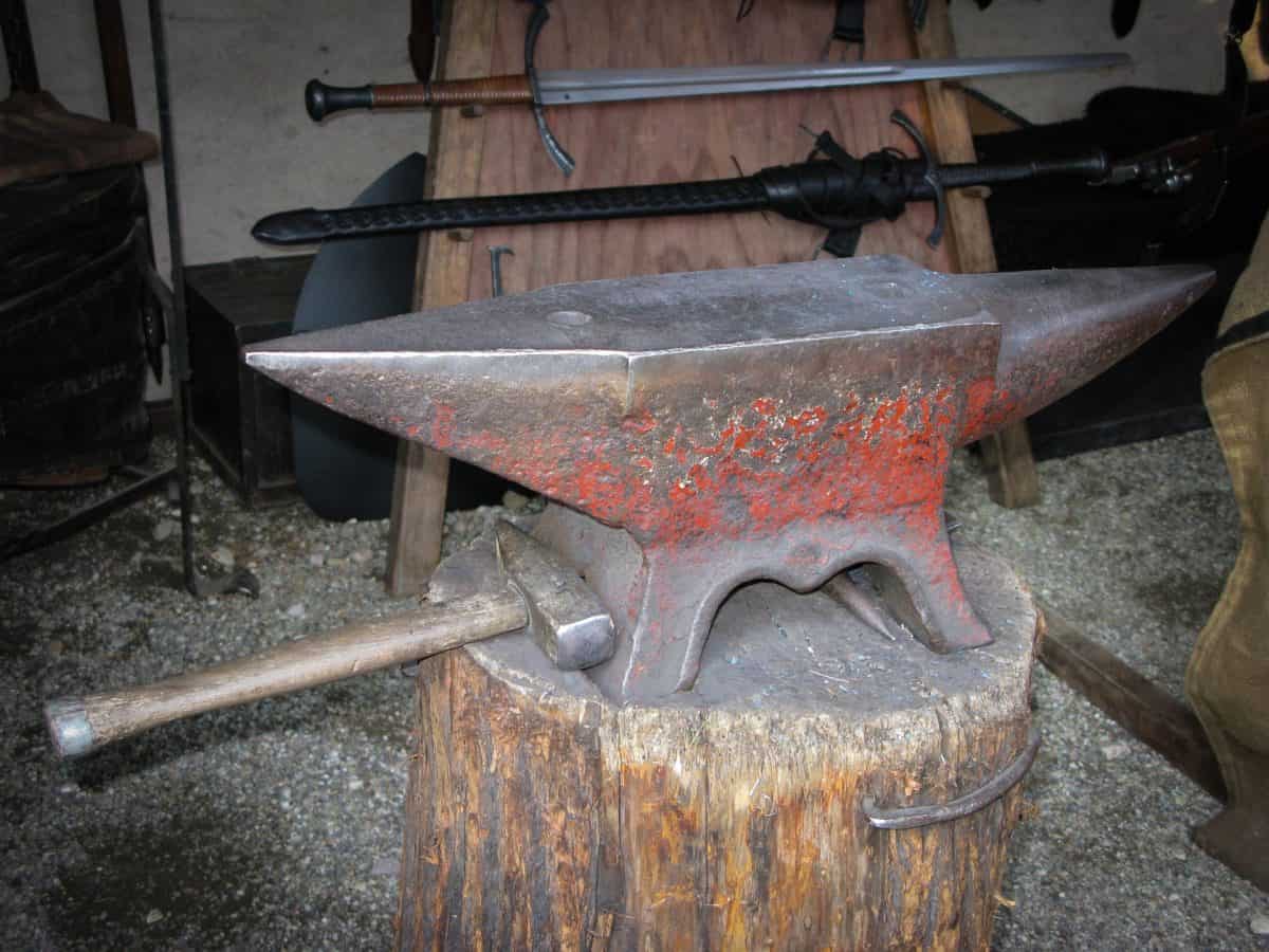 A tree stump anvil stand