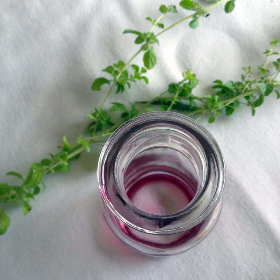 Empty jar of Elderberry syrup with lemon balm
