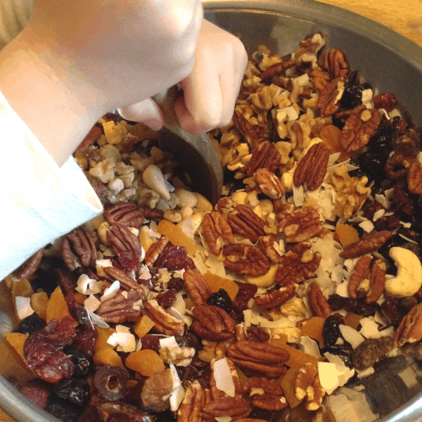little hands mixing granola bars