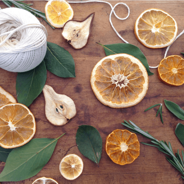 how to make a dried fruit and herb wreath #Christmascrafts #naturaldecorating #traditionalChristmas #farmhouseChristmas #farmhouseporch