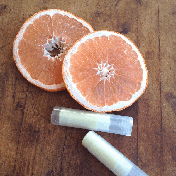 Easy DIY grapefruit lip balm made with all natural ingredients and essential oil #easydiy #naturalbeauty #naturalhealth #grapefruit #essentialoils #EORrecipes #EssentialOilDIY