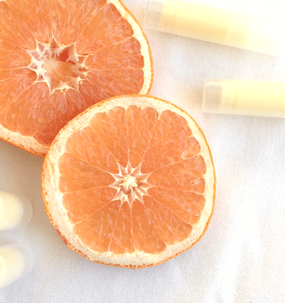 Easy DIY grapefruit lip balm made with all natural ingredients and essential oil #easydiy #naturalbeauty #naturalhealth #grapefruit #essentialoils #EORrecipes #EssentialOilDIY
