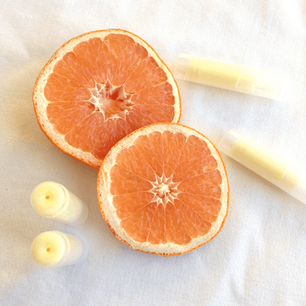 Easy DIY grapefruit lip balm made with all natural ingredients and essential oil #easydiy #naturalbeauty #naturalhealth #grapefruit #essentialoils #EORrecipes #EssentialOilDIY