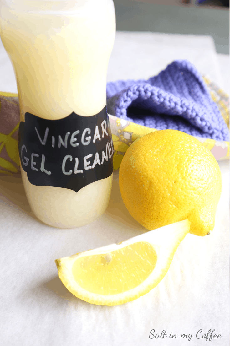 bottle of diy vinegar gel cleaner with handmade cleaning cloth