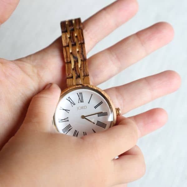 wooden watch with mom and child hands