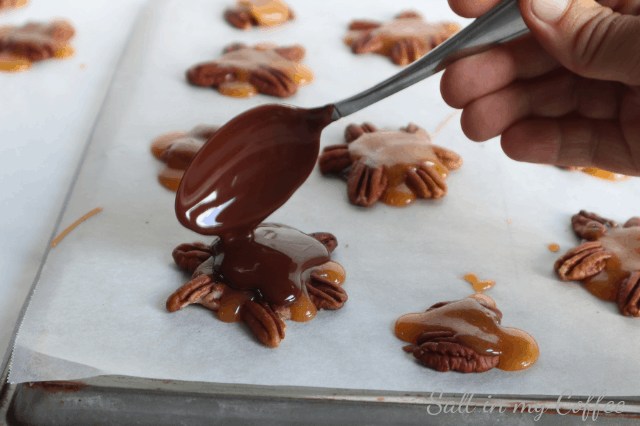 pouring chocolate for paleo maple caramel pecan turtles