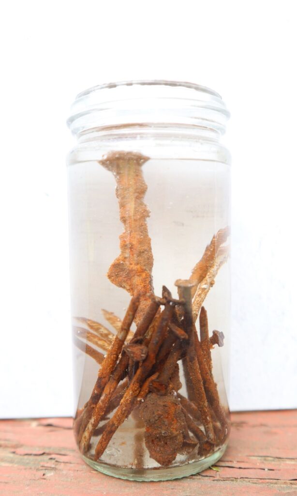 rusty nails in vinegar solution for making an iron modifier