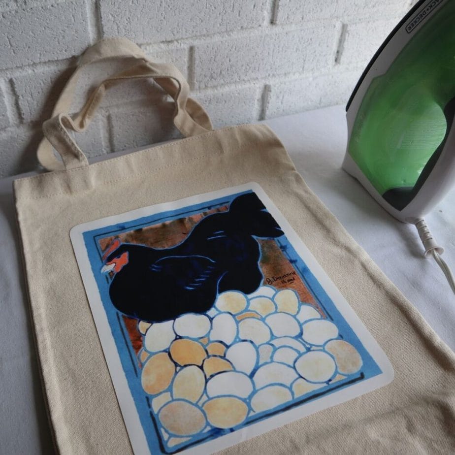 Putting a vintage advertising poster image onto a tote bag, using photo transfer paper and an iron