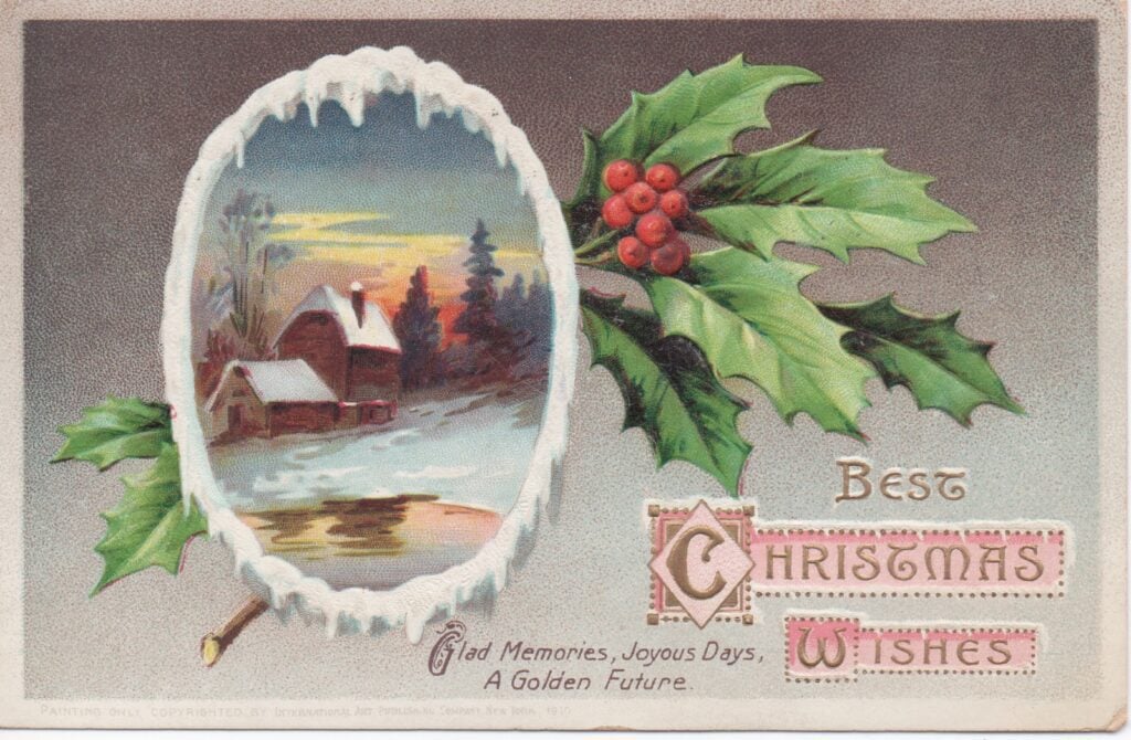 Vintage Christmas postcard with holly and snowy scene