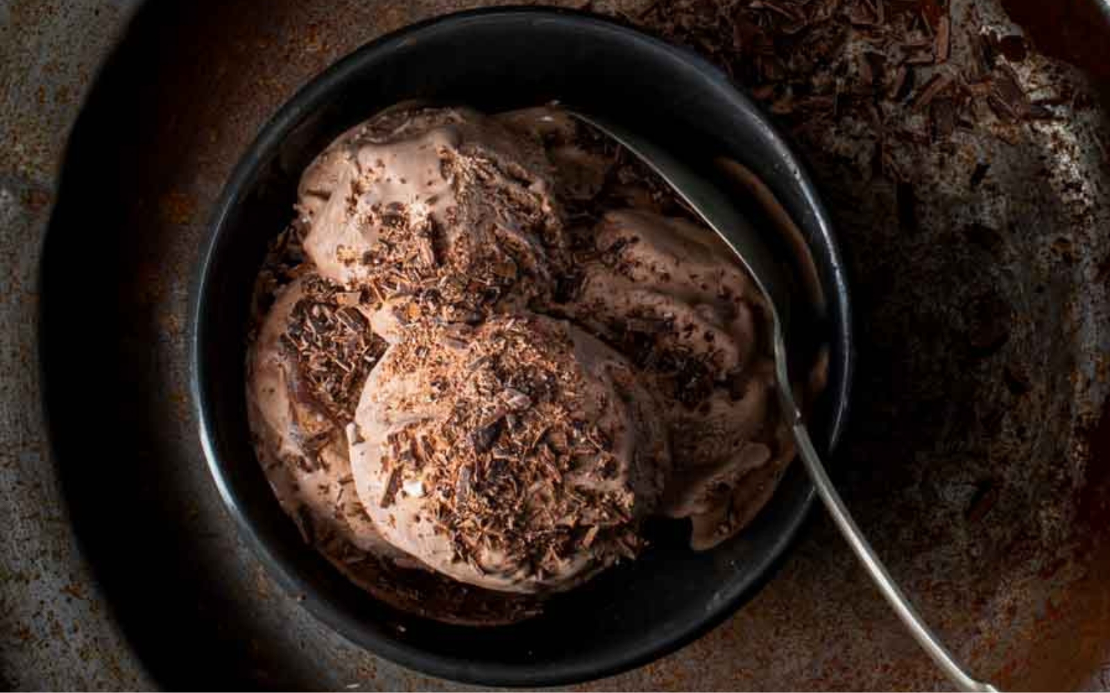 small bowl of chocolate ice cream with chocolate shavings