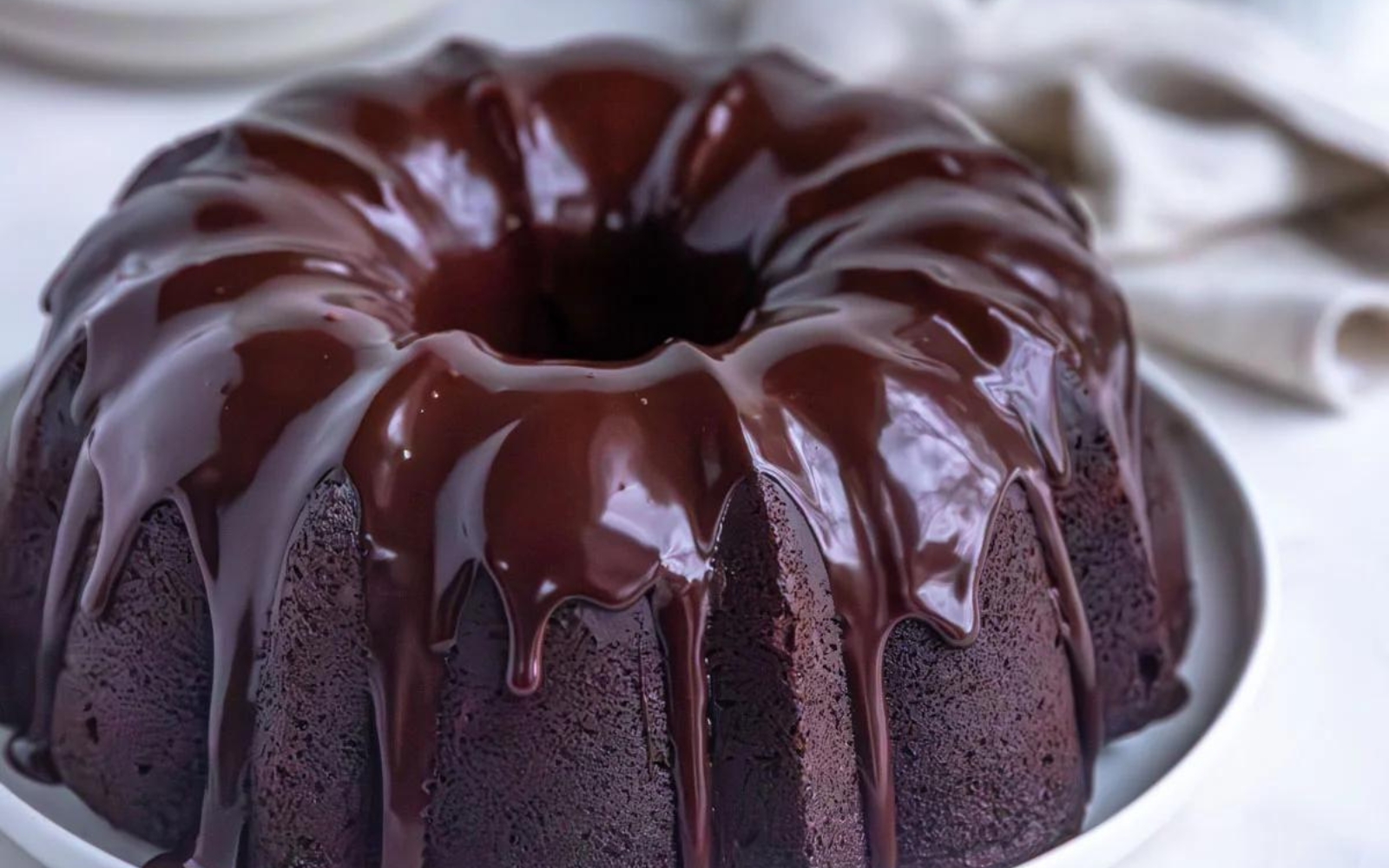 a chocolate sour cream bundt cake with chocolate glaze