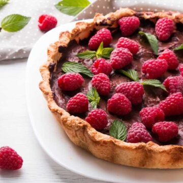 chocolate tart covered with raspberries