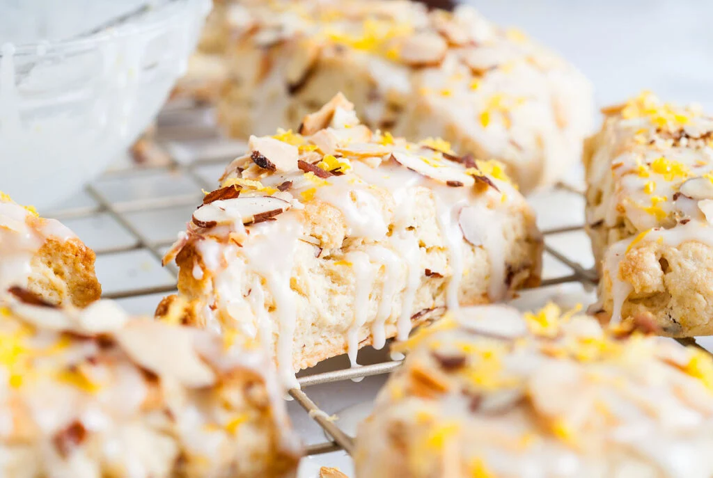 cooling rack covered with lemon almond scones