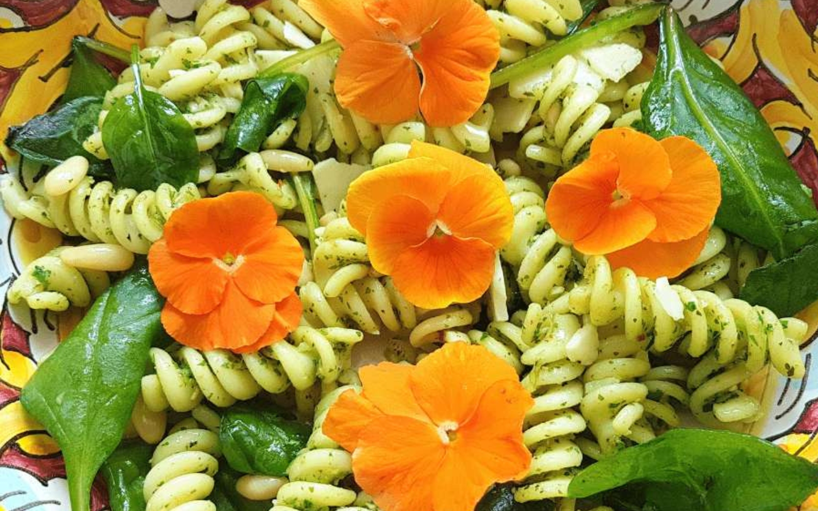 pasta salad topped with impatiens