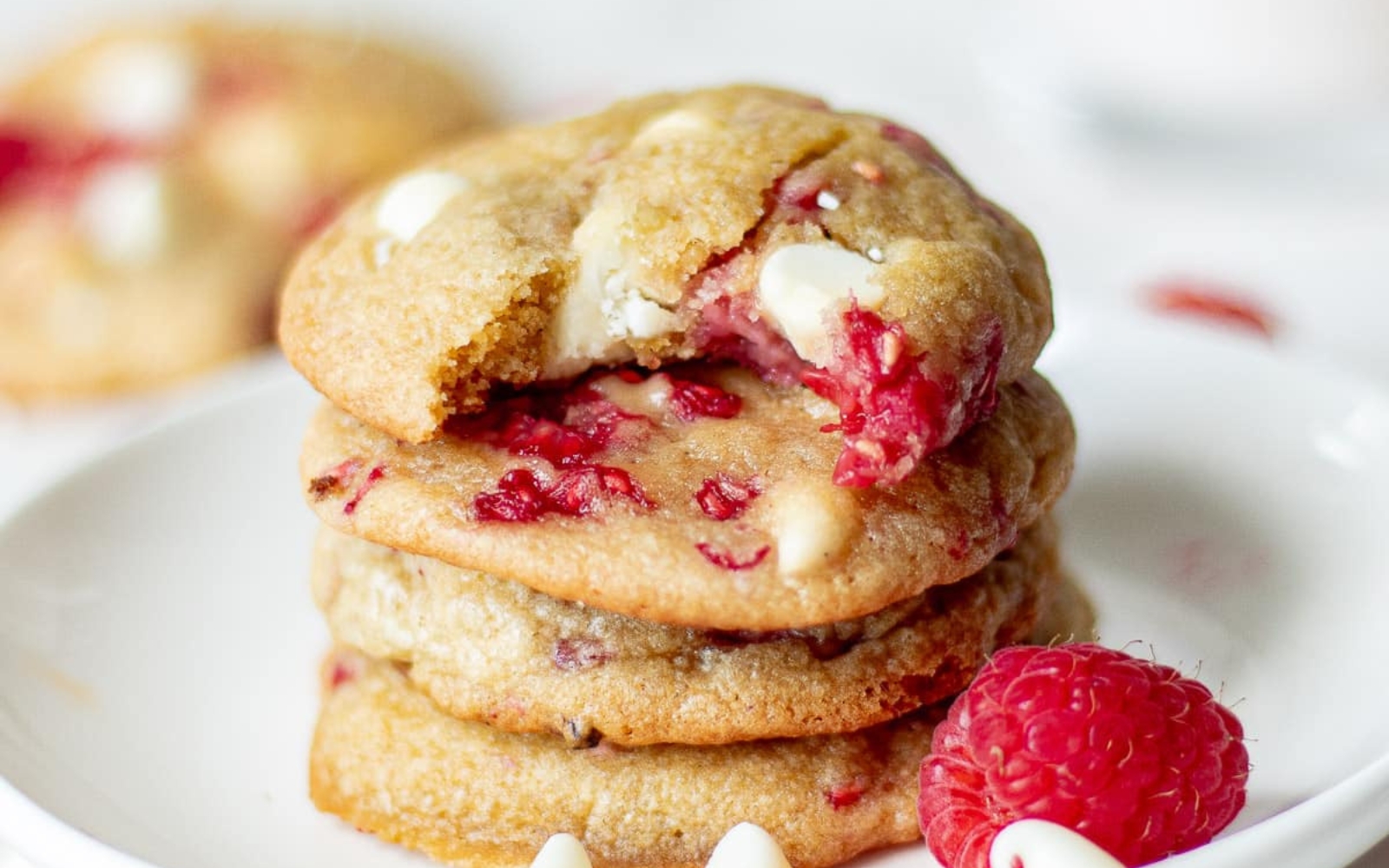 a stack of raspberry cookies with white chocolate chips