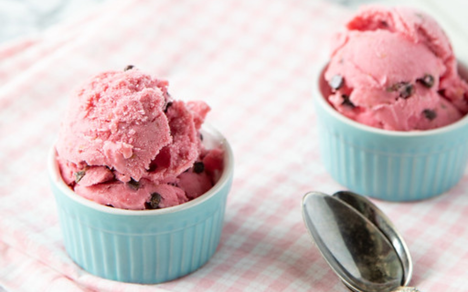 two little ramekins of pink raspberry frozen yogurt
