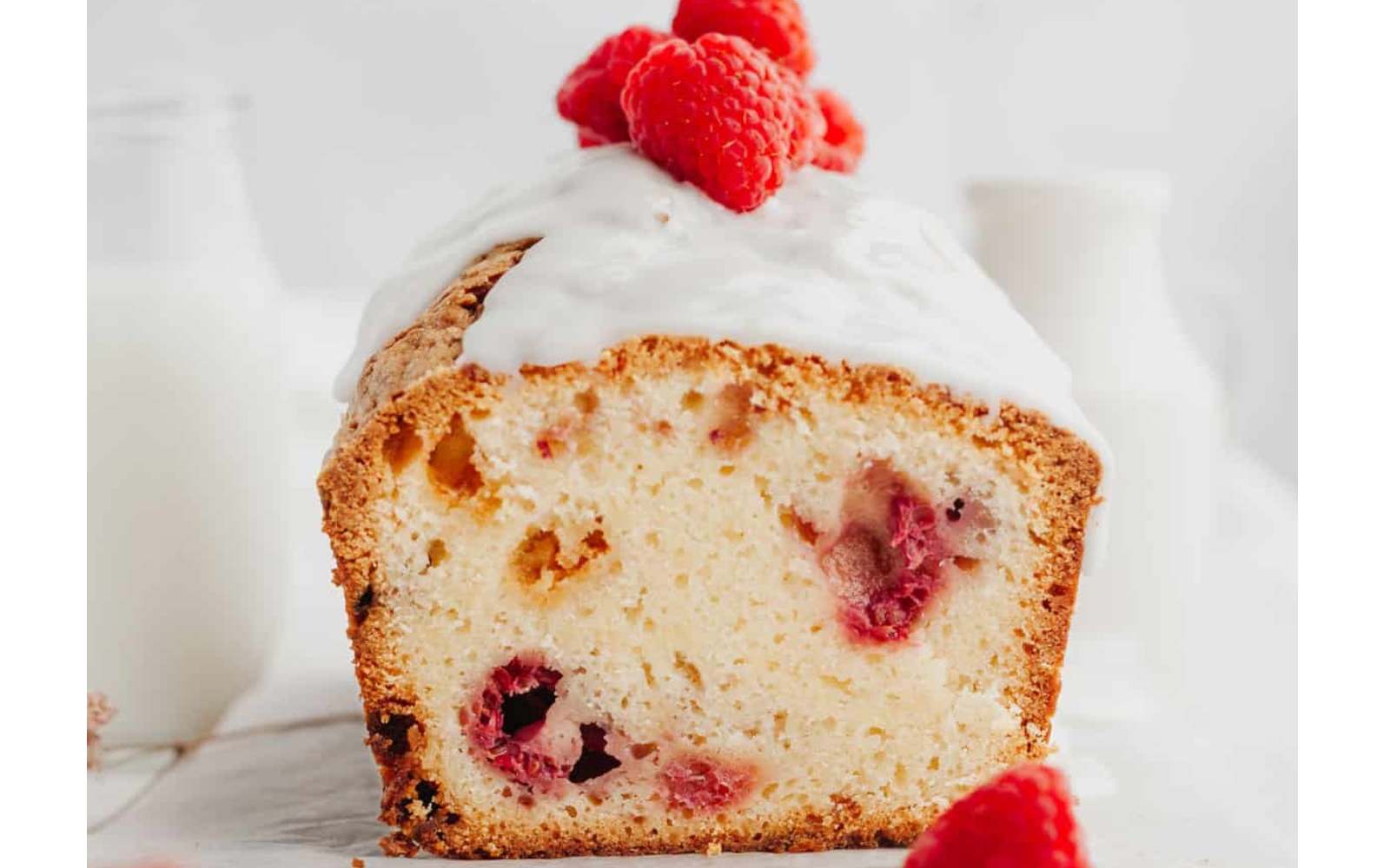 a glazed raspberry loaf cake