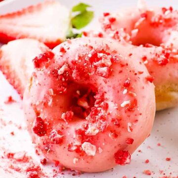 plate of strawberry glazed donuts