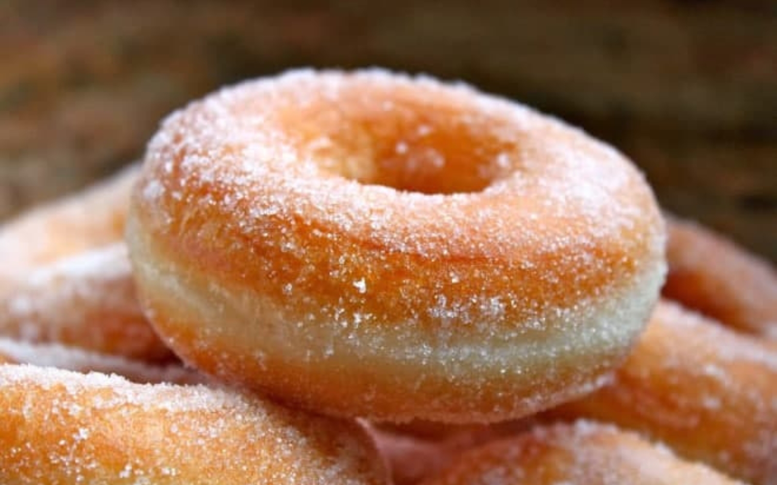 a simple yeast donut, lightly covered with sanding sugar