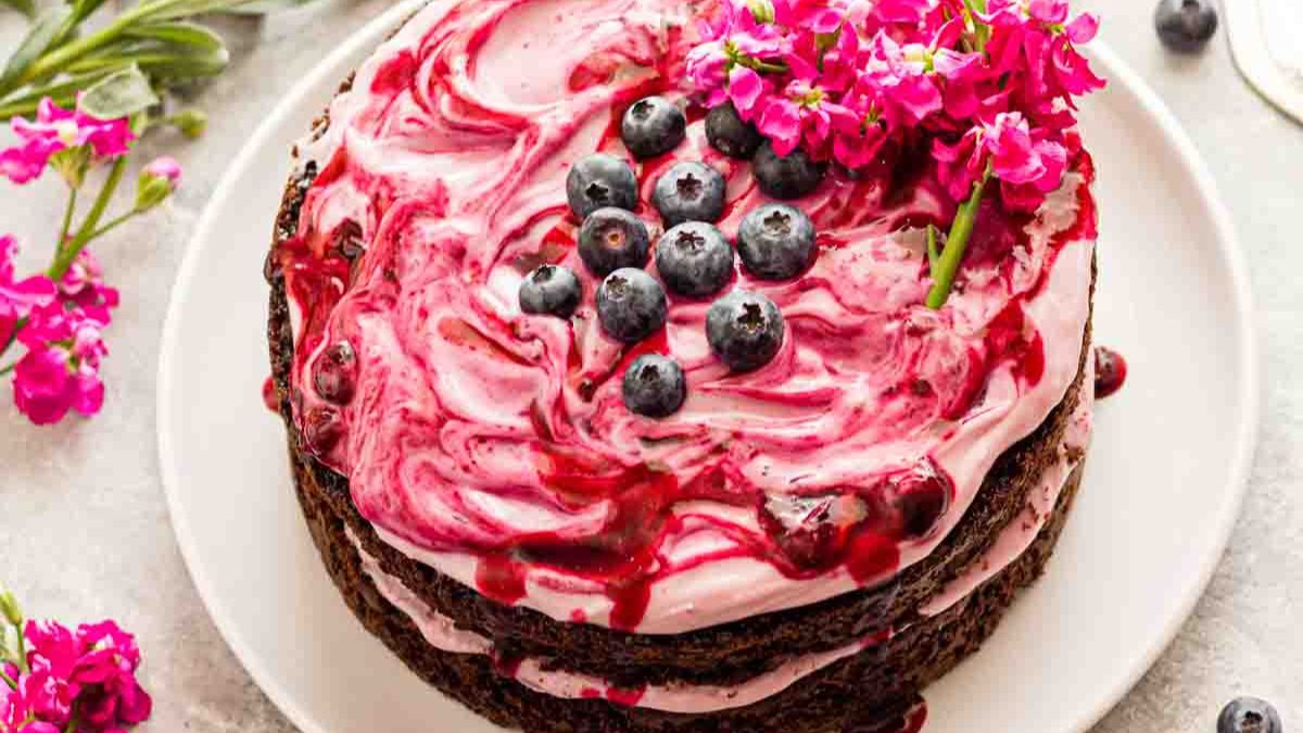 Blueberry chocolate cake topped with flowers