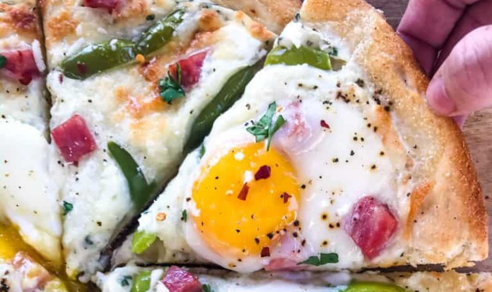 a pizza with eggs on top