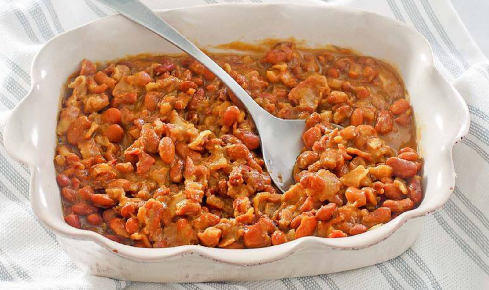 a baking dish full of bbq baked beans