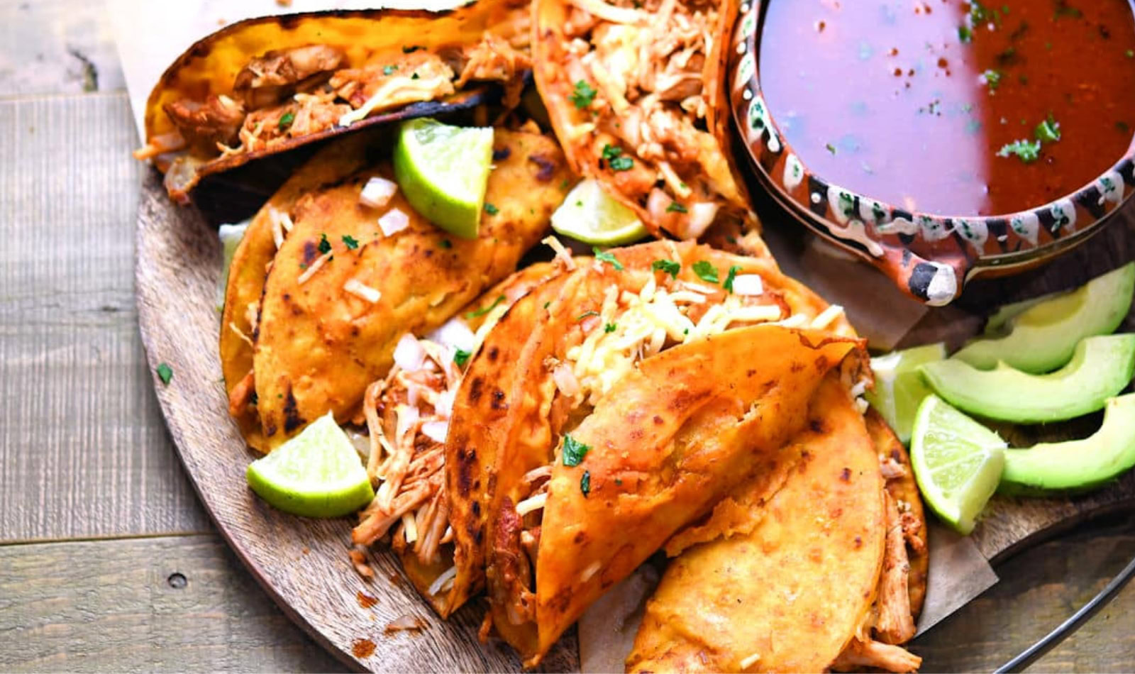 a plate of crispy chicken tacos