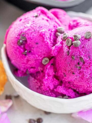 a bowl full of pink dragon fruit ice cream