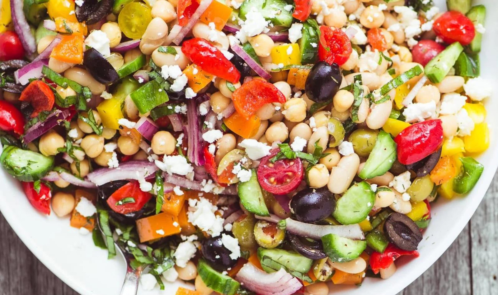 a big bowl of mediterranean bean salad