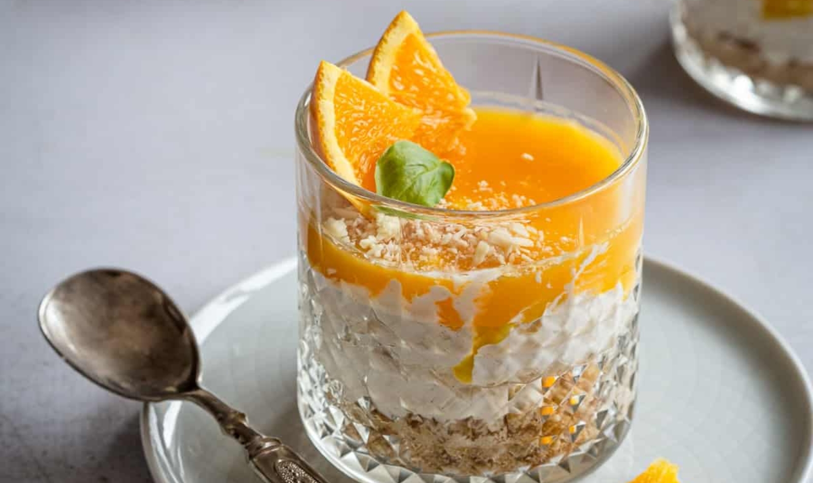 individual orange cheesecake in a glass