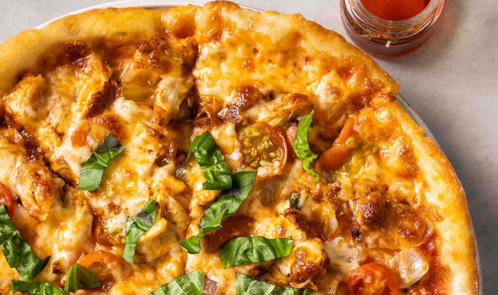 a pizza with paprika chicken