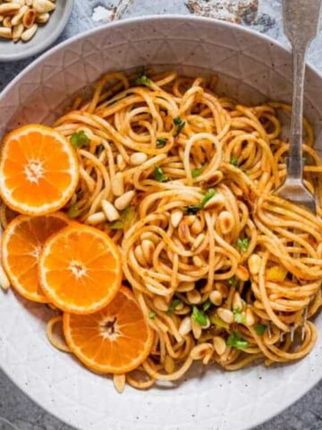 a plate of orange pasta