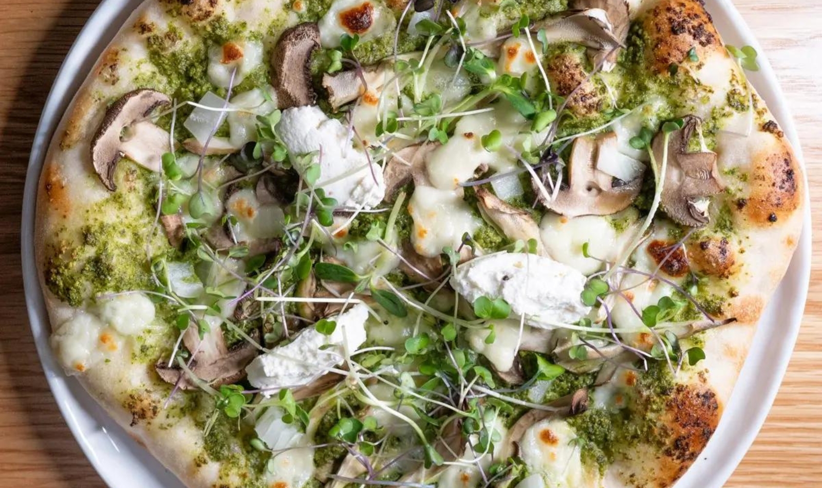 a pesto and goat cheese pizza