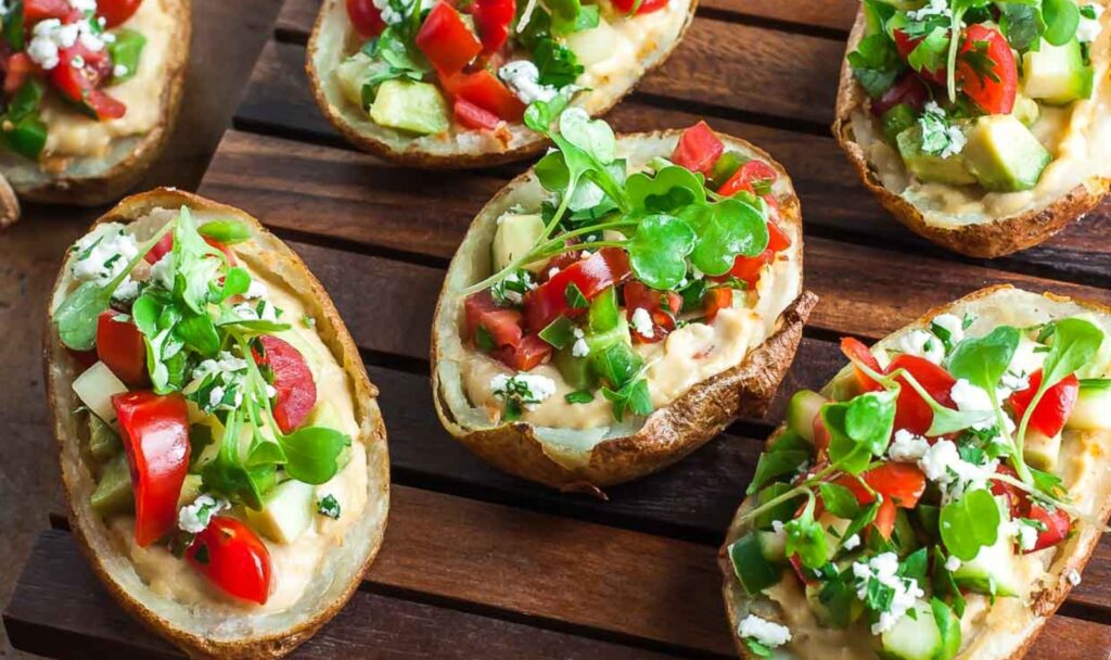 a tray of potato skins with toppings