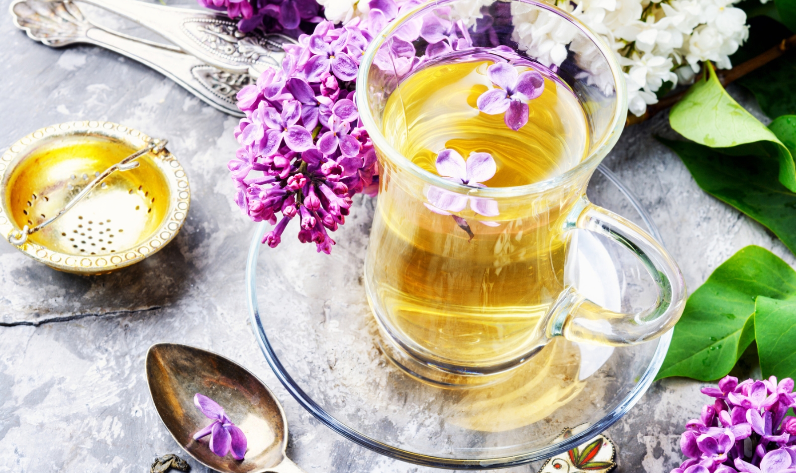 a cup of tea with lilacs