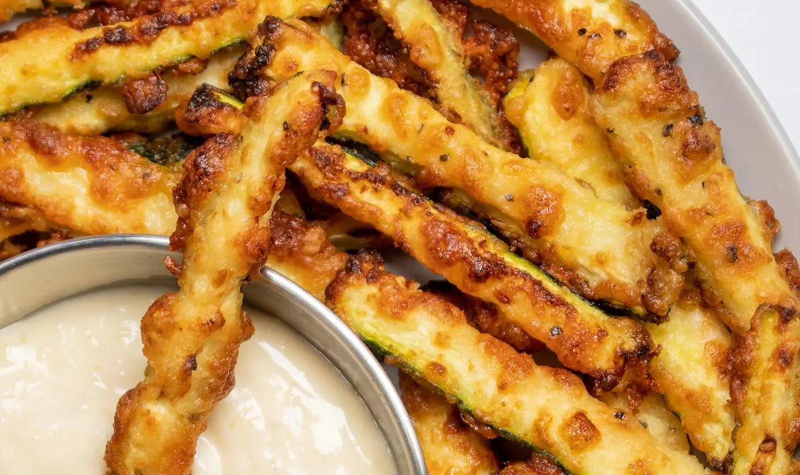 a plate of zucchini fries