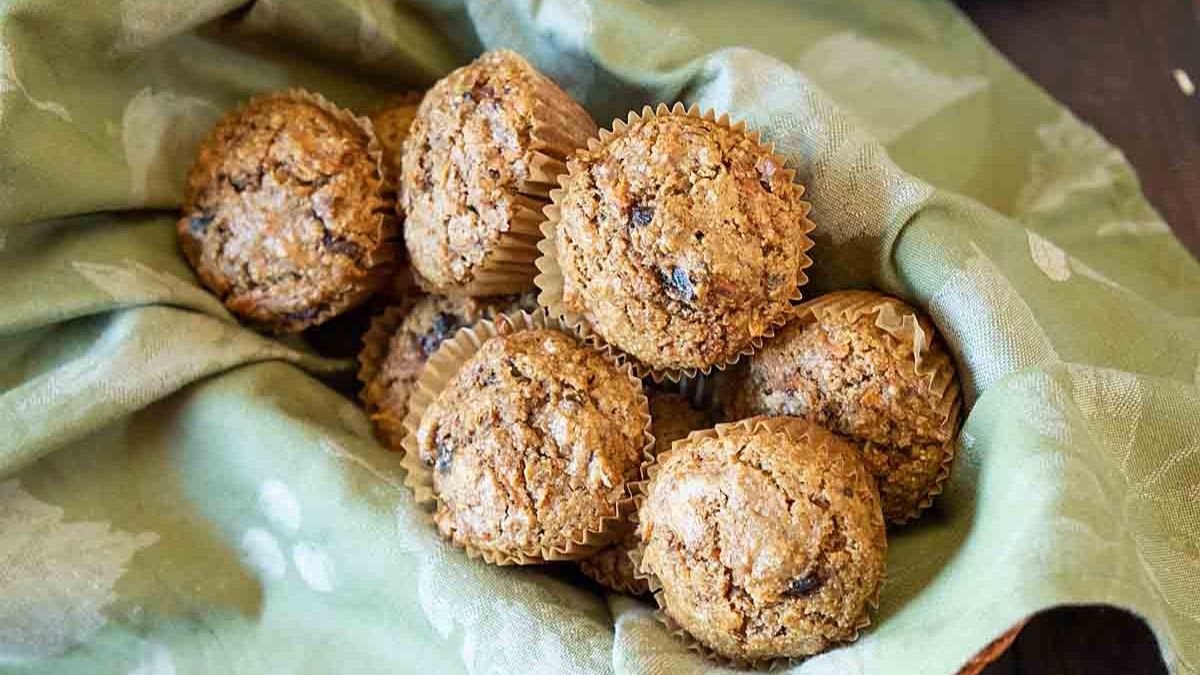 Carrot oat bran muffins on a green cloth