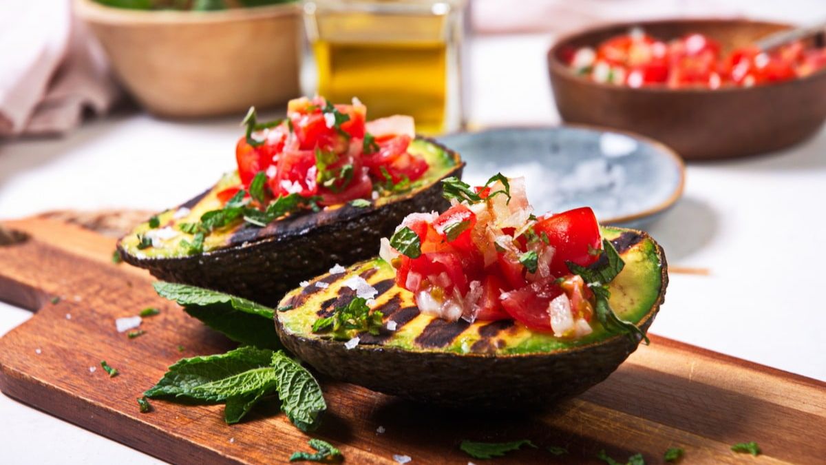 Grilled avocado filled with fresh salsa