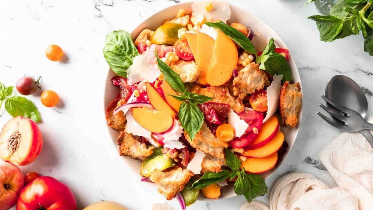 Salad with peach served in white plate