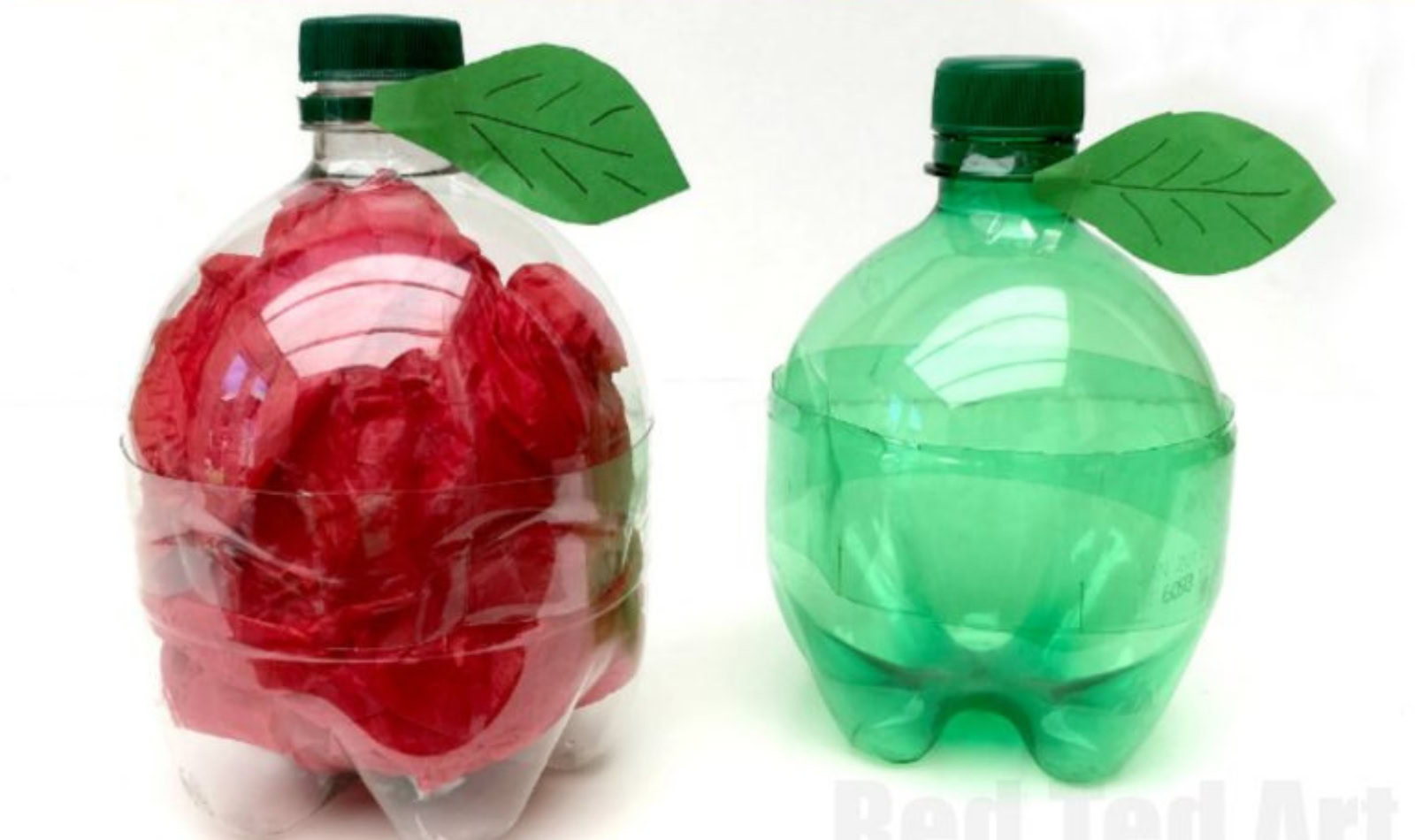Image of two plastic soda bottles that have been cut and turned into plastic apples.