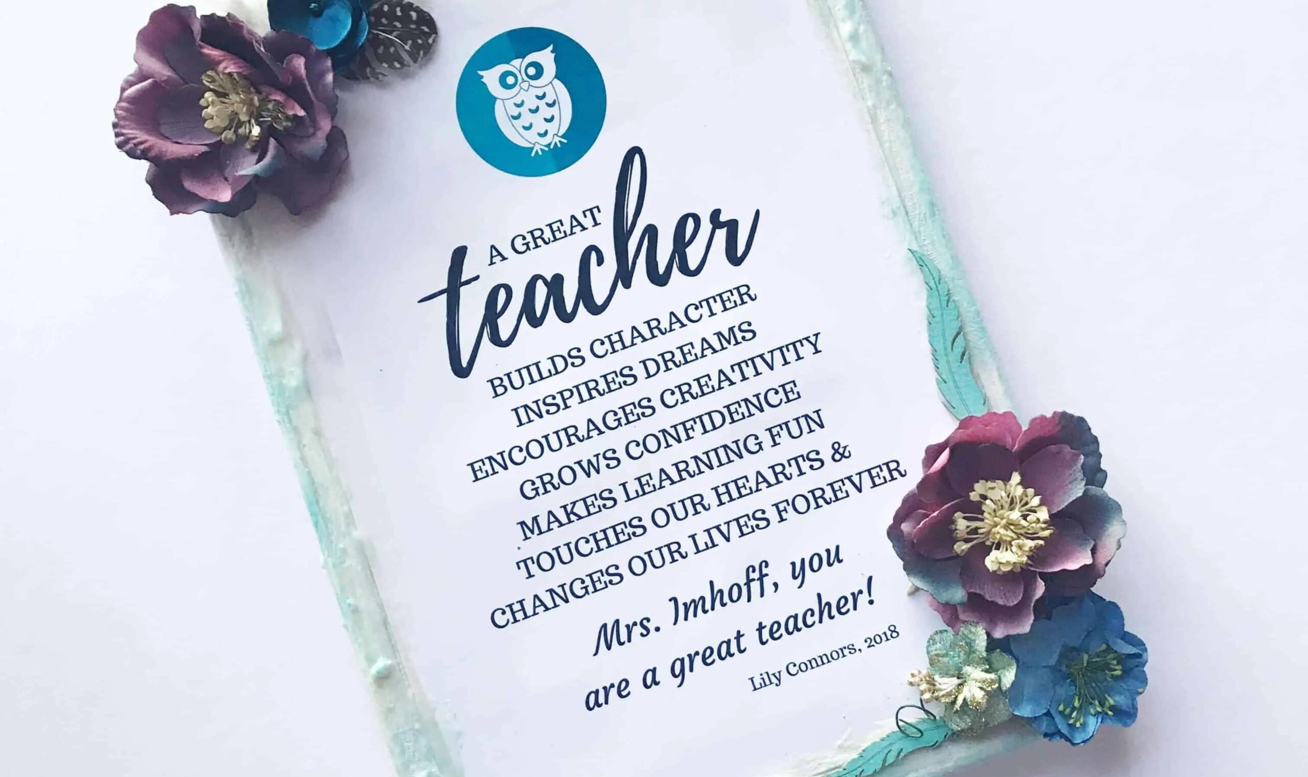 FLowers glued on corners of canvas with words of teacher appreciation on it with an owl.