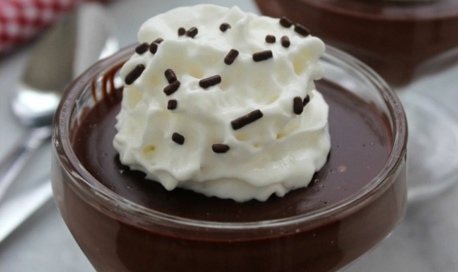 image of creamy smooth chocolate pudding in a clear glass pudding cup