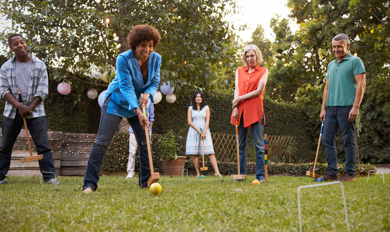friends playing croquet