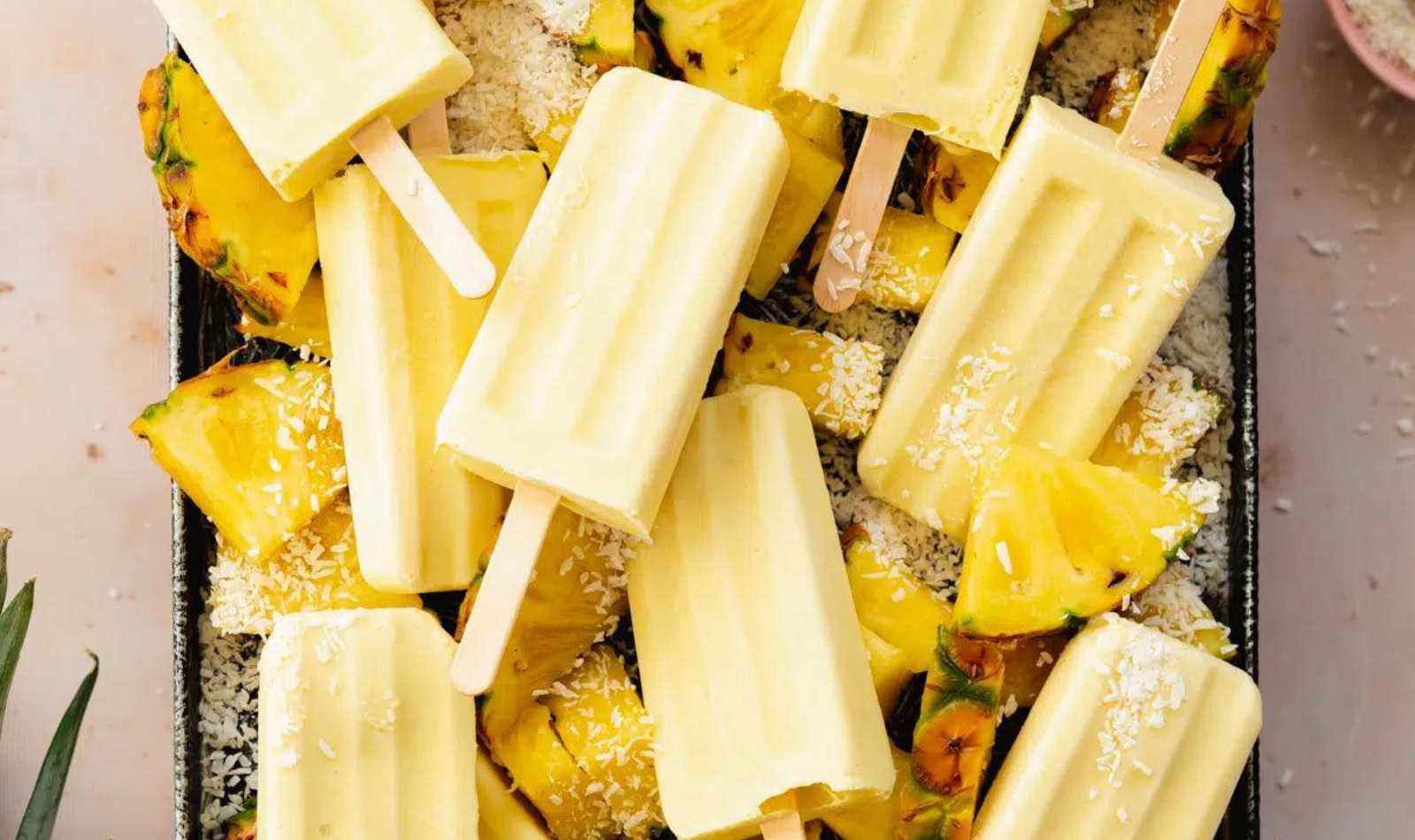 a tray full of pina colada popsicles