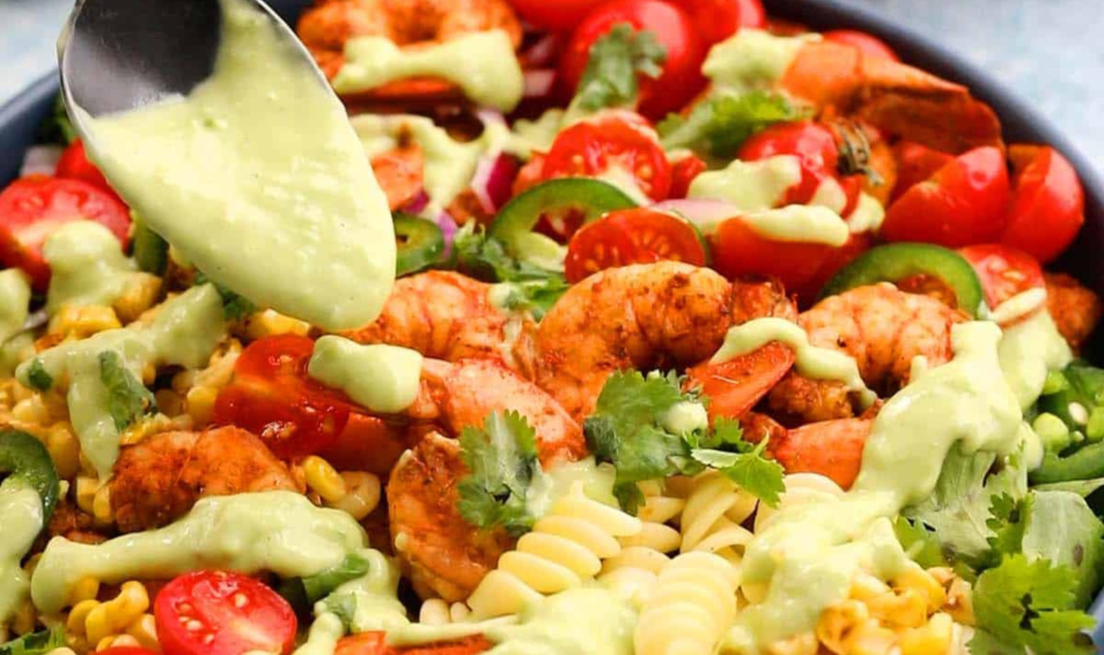 a shrimp pasta salad with avocado dressing