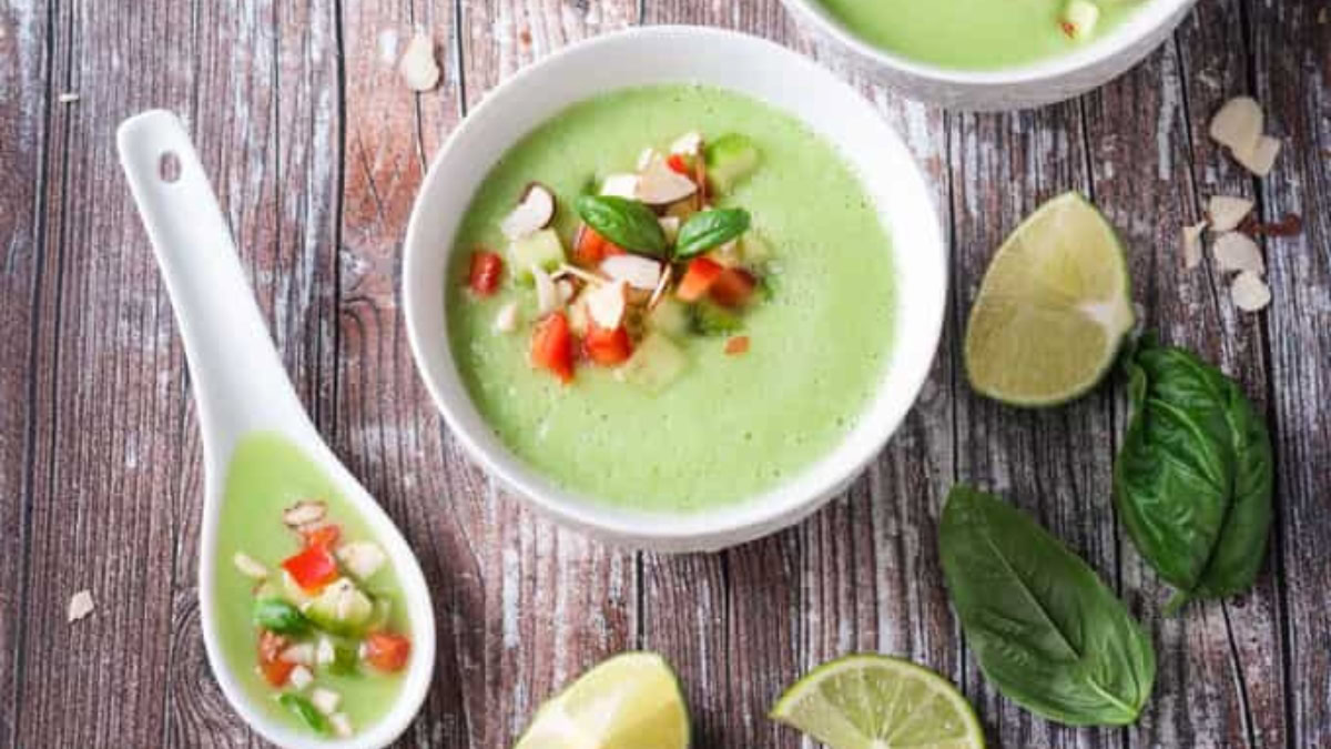 Cold cucumber soup served with lime and basil