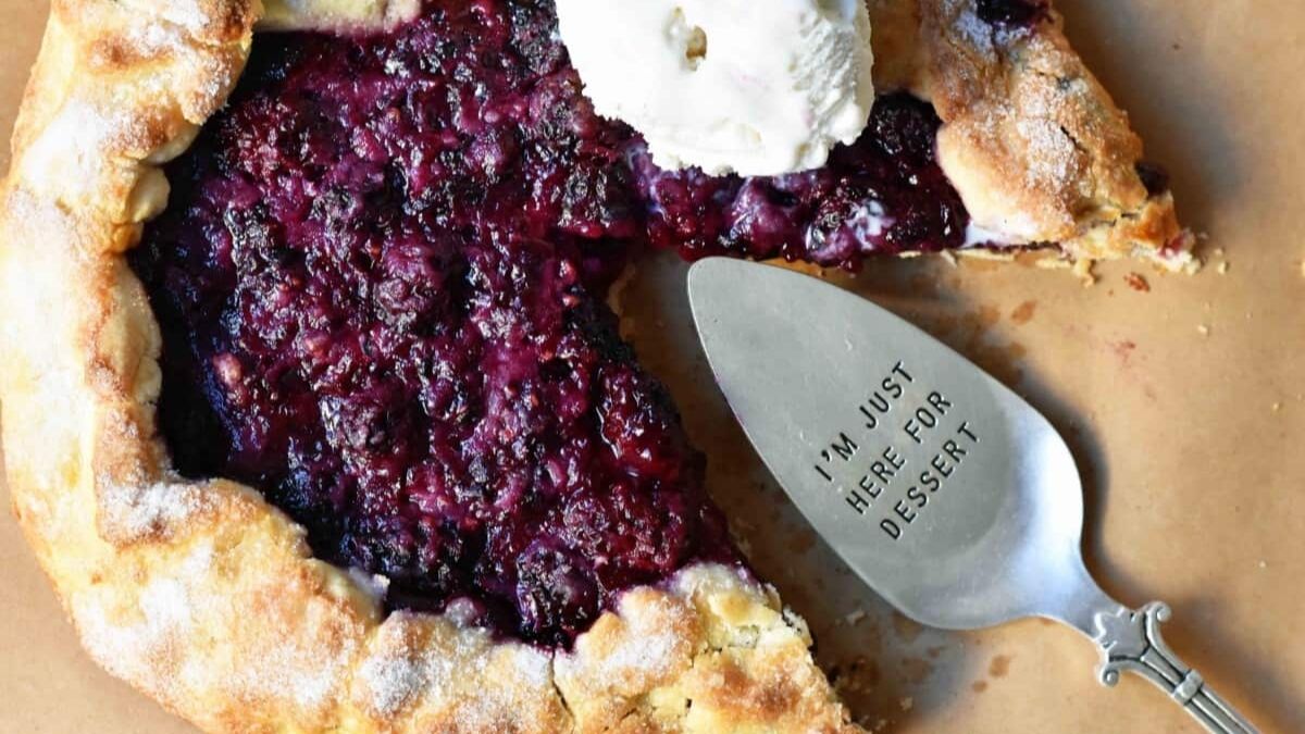 Blackberry Galette served with vanilla and metal serving spoon