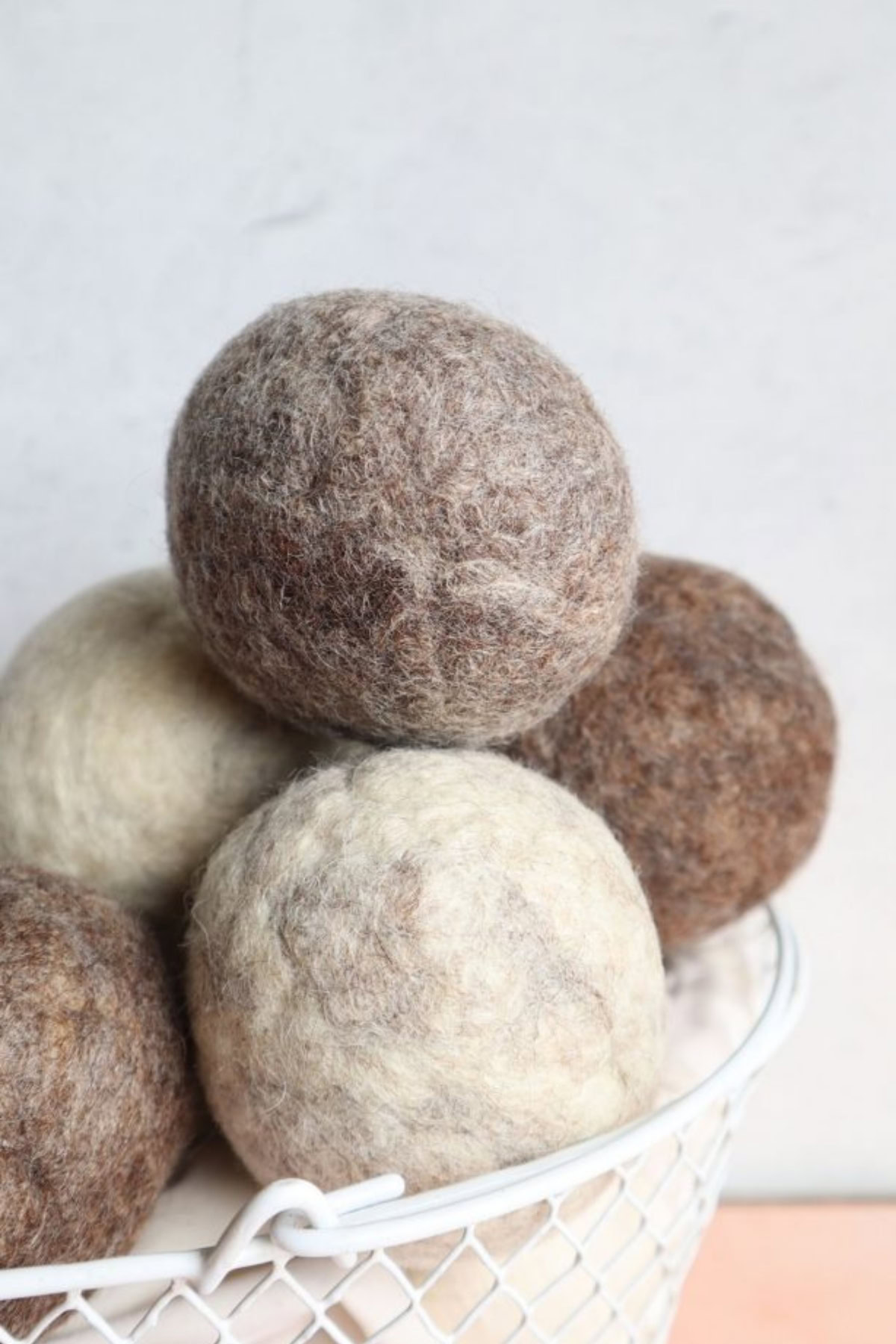 wool dryer balls in a basket