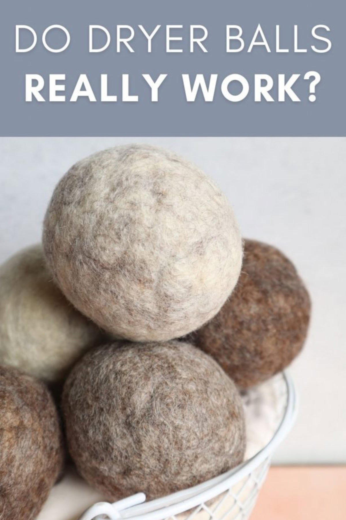 a pile of wool dryer balls in a white basket